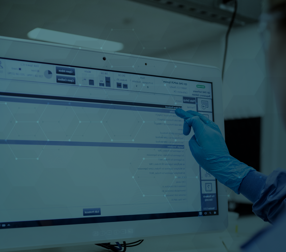 Image with a graphical overlay of a worker using touchscreen equipment at a research and development CDMO facility