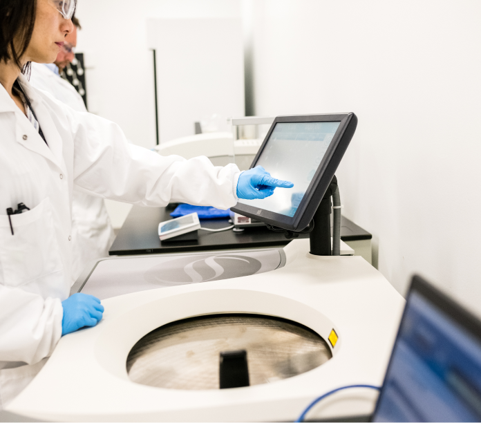 Image of equipment being used by a team member at the Center for Breakthrough Medicine's research and development facility for cell line, plasmid and viral vector process development