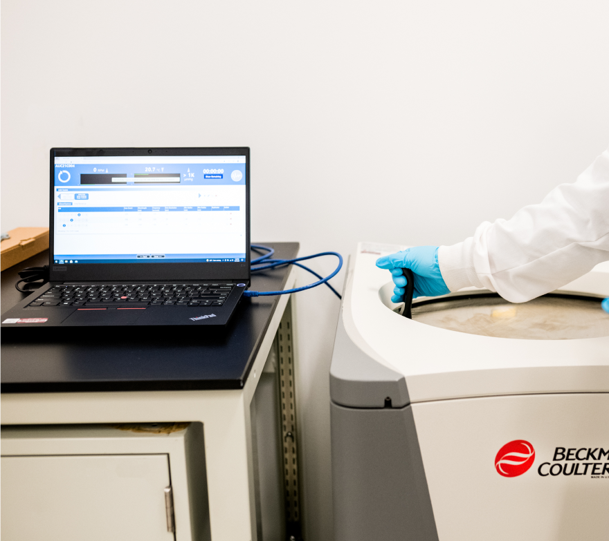 Photo of a laptop and equipment used in quality assurance and regulatory services by CBM
